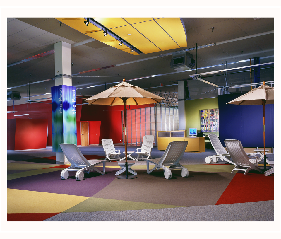 Image courtesy www.techbc.ca, a historical archive of TechBC memories. Photo of "the Pool" seating area with bright carpets and walls.
